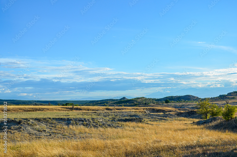 plains landscape with blue sky. Tatacoa desert in Colombia plains landscape with blue sky. Tatacoa desert in Colombia