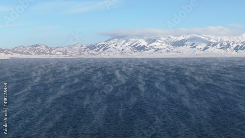 Aerial View of China Xinjiang Sayram Lake(sailimu hu) in winter. Climate and travel concept. Drone Shot Footage 4K (UHD). photo