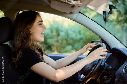 Inattentive female driver on road. Moment bofore car crash. Car accident concept in the countryside