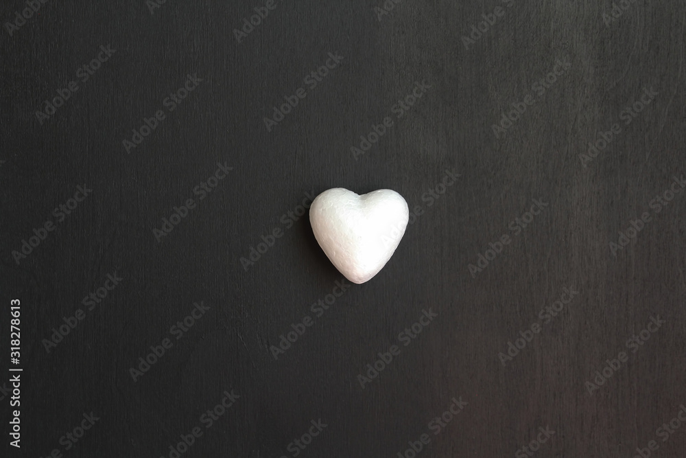 Fototapeta premium Heart isolated on black background for text