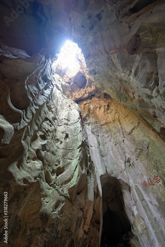 Inside the cave with light above hole