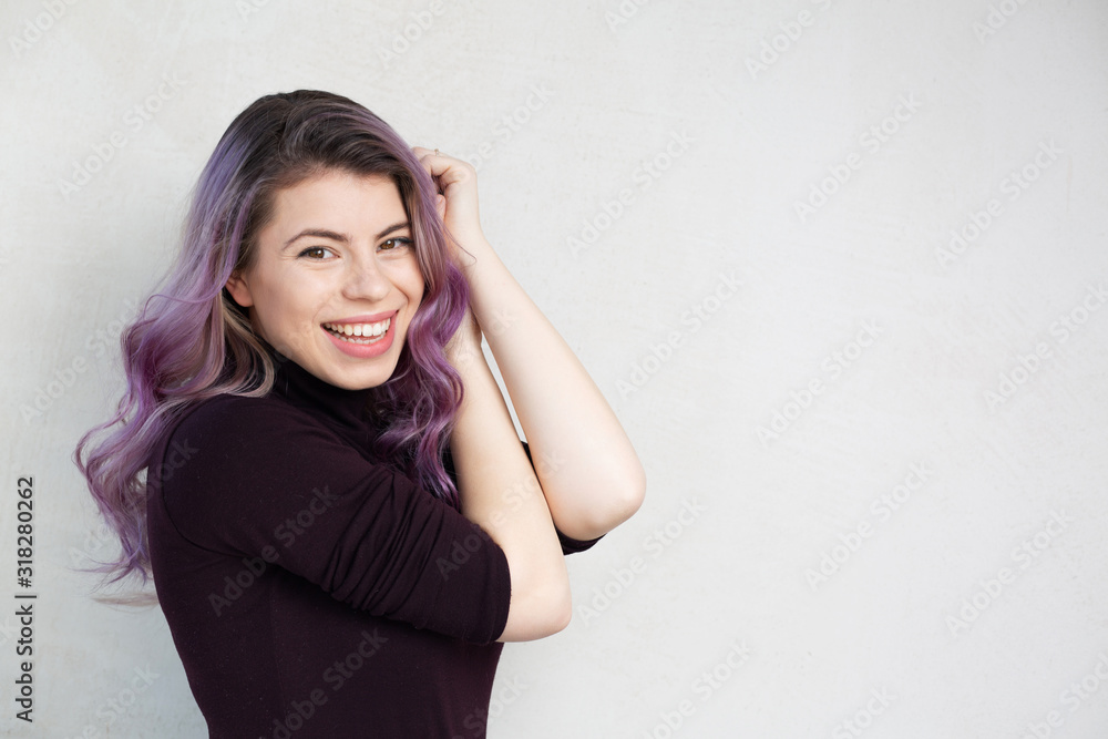 Gorgeous young woman over a grey background Gorgeous young woman over a grey background