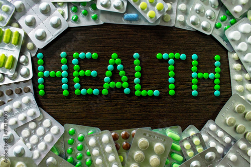 Frame, frames from pills spilling on a brown background with the words 