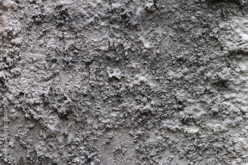 Concrete texture gray-boloy colors. Harsh texture for design and decorations. Natural building material. Natural patterns on the stone. Plates for floor and walls