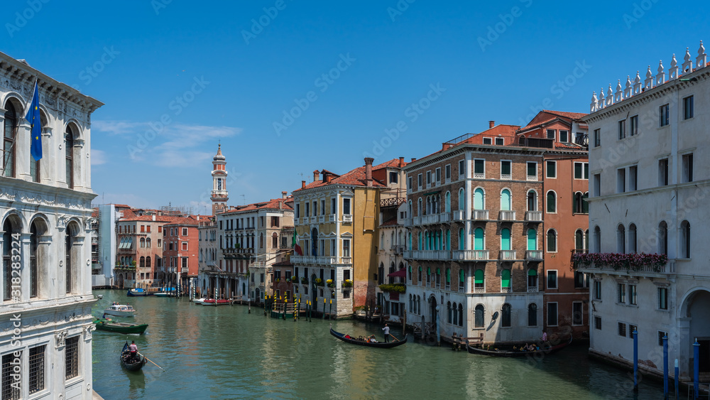 Venice/ Italy . View of Venice Streets, canals, bridges, boats, gondolas. Biennale. Colorful Old Authentic Buildings in Venice. Ancient Italian city. Travel in Europe. Tourism Concept. 