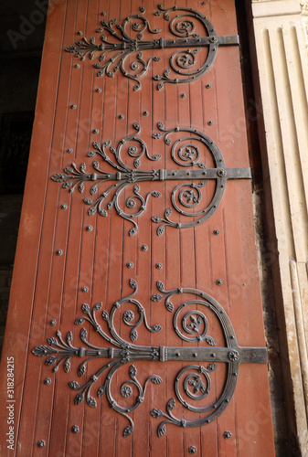  Decorated hinges in the door of Saint Trophime Cathedral in Arles, France. Bouches-du-Rhone, France photo