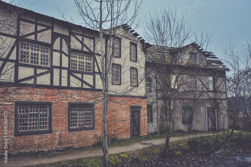 wooden medieval european house, 18th century european city building, old european-style wooden house