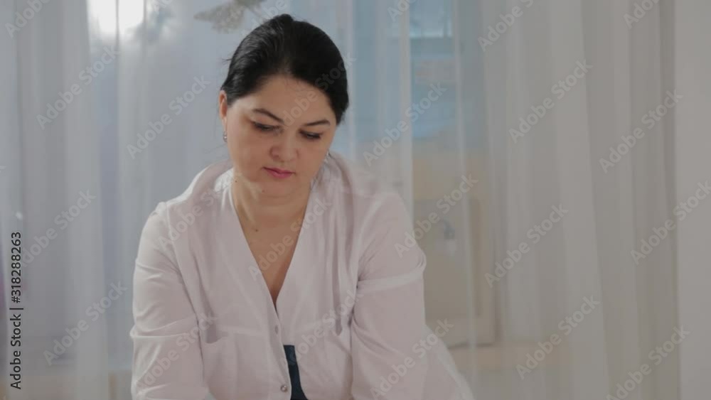 Woman massage therapist does massage on the calf muscles of a young girl. Woman massage therapist does massage on the calf muscles of a young girl.