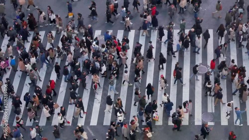 night time view from above of people crossing road at Shibuya shopping street area Famous Tokyo japan tourist attraction in night time