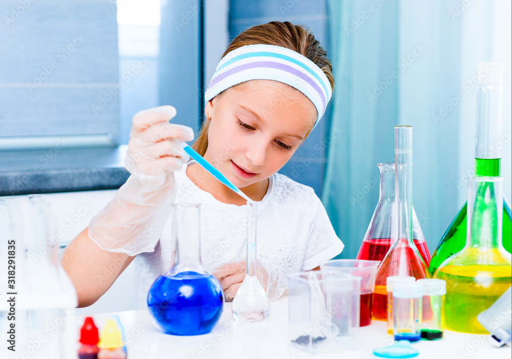 little girl with flasks for chemistry little girl with flasks for chemistry