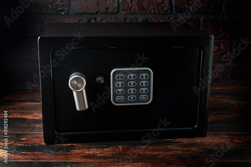 Steel Safe, Safety box or modern electronic locker on wooden background