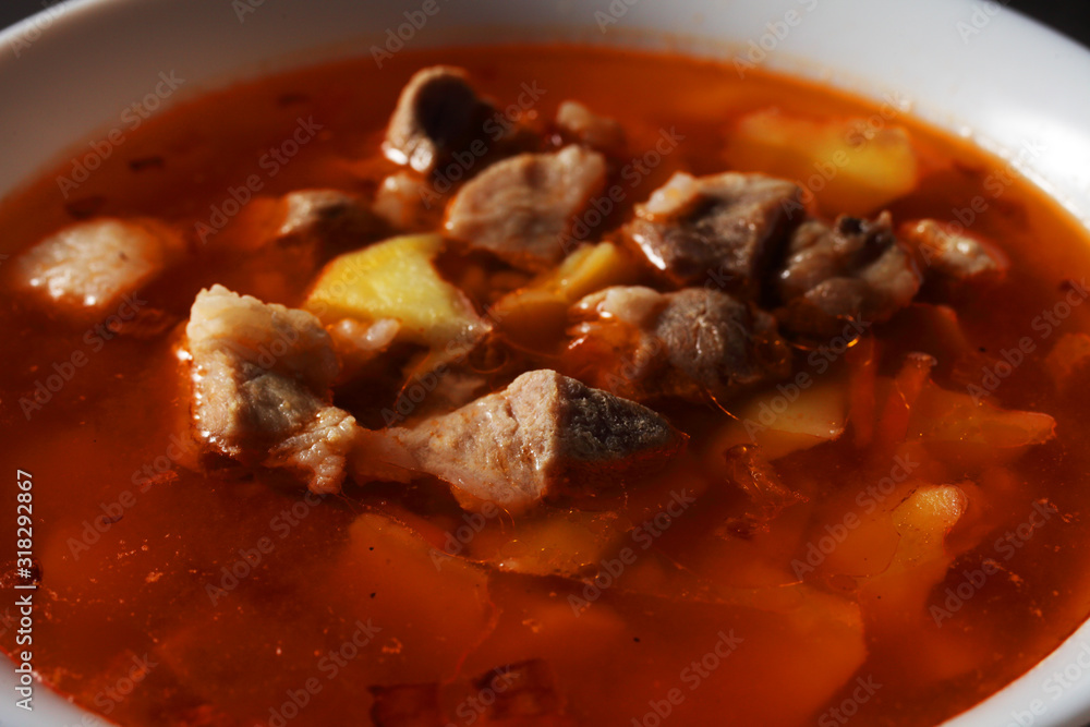 kharcho soup on a dark background close-up kharcho soup on a dark background close-up