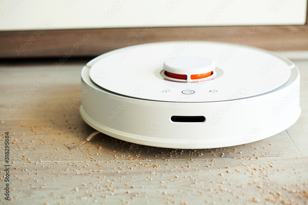 Robot vacuum cleaner performs automatic cleaning of the apartment at a certain time. Smart home Robot vacuum cleaner performs automatic cleaning of the apartment at a certain time. Smart home