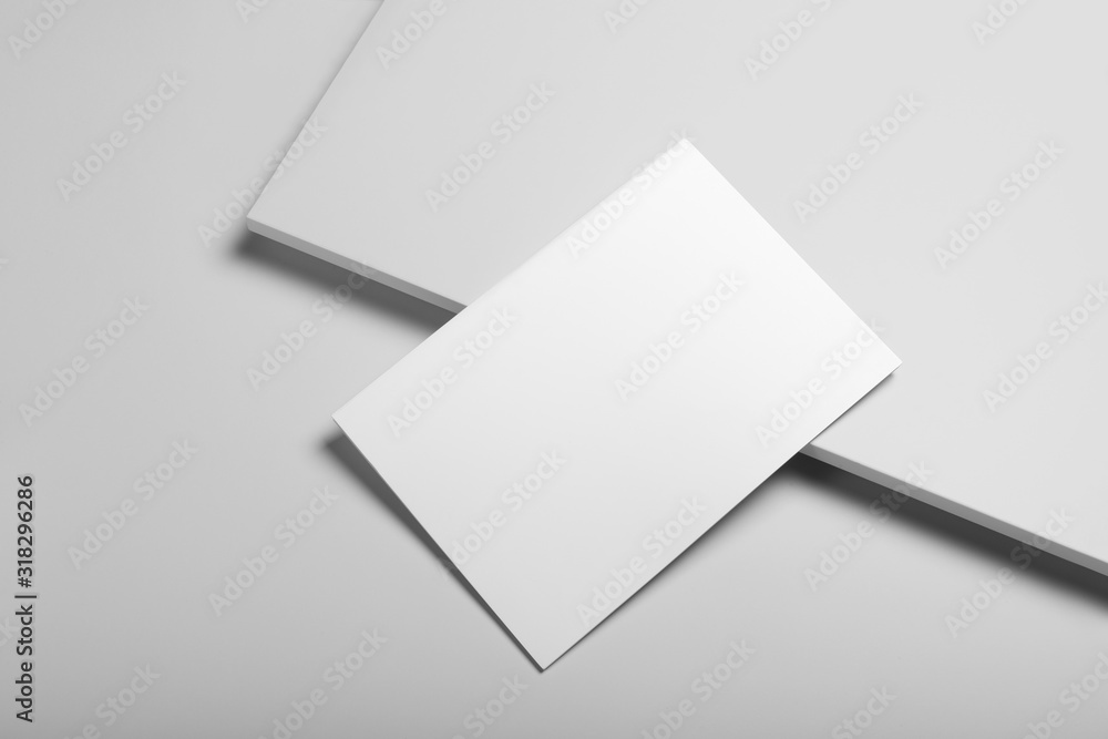 Real photo blank portrait A4, US-Letter, brochure magazine mockup isolated on gray background. Real photo blank portrait A4, US-Letter, brochure magazine mockup isolated on gray background.