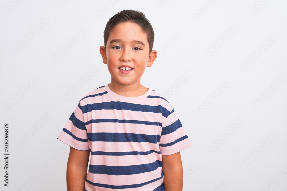Beautiful kid boy wearing casual striped t-shirt standing over isolated white background with a happy and cool smile on face. Lucky person. Beautiful kid boy wearing casual striped t-shirt standing over isolated white background with a happy and cool smile on face. Lucky person.