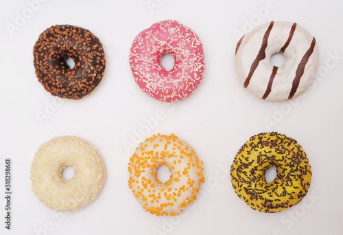 Delicious donuts on light background.