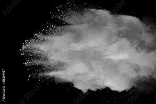 Explosion of white dust on black background.