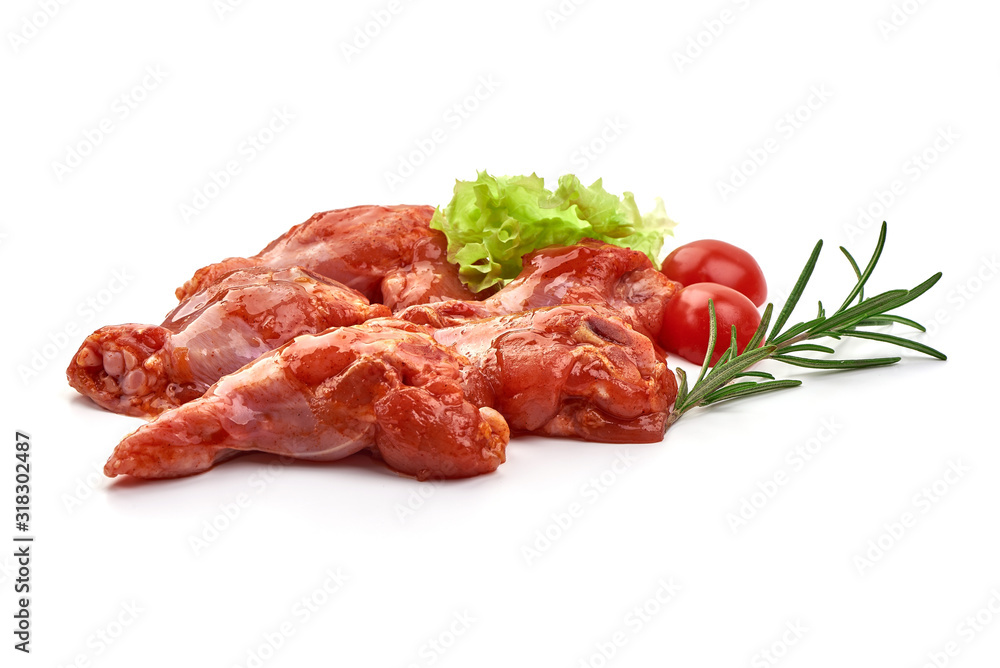 Raw chicken legs in a barbecue marinade, isolated on white background
