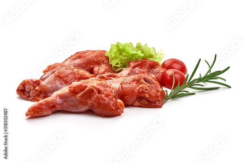 Raw chicken legs in a barbecue marinade, isolated on white background
