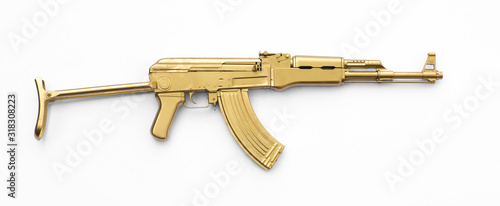golden AK-47 assault rifle isolated on white background photo