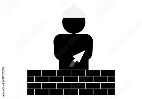 Silueta de un hombre construyendo muro de ladrillos.