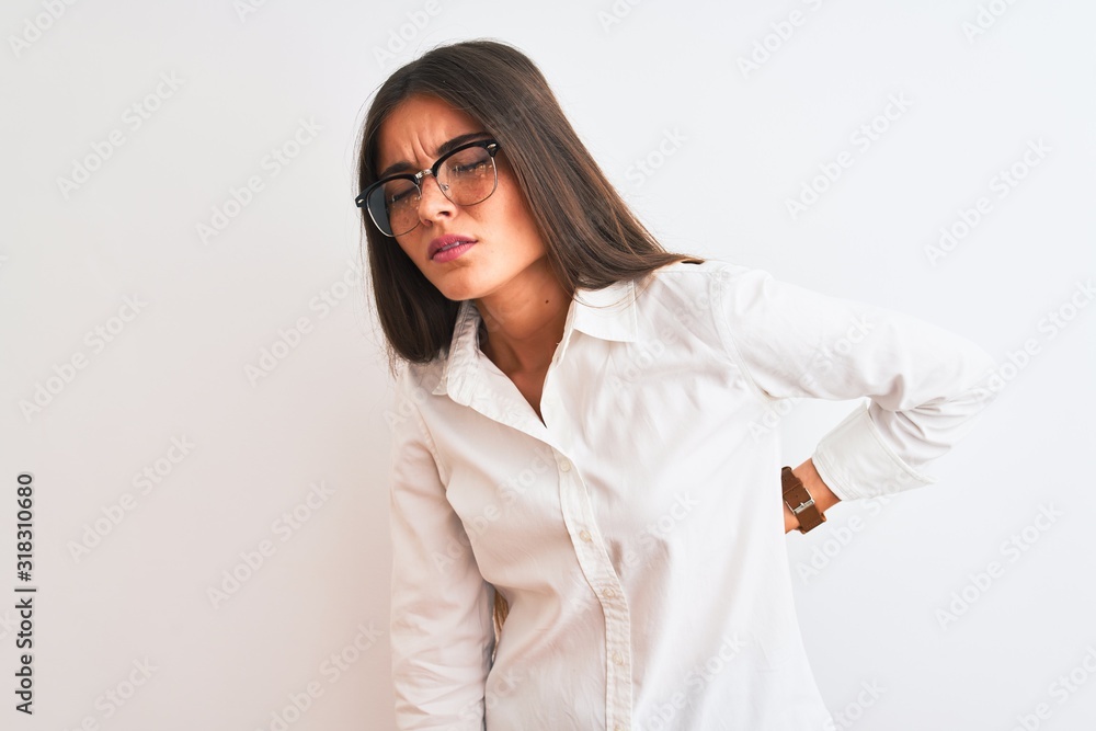 Young beautiful businesswoman wearing glasses standing over isolated white background Suffering of backache, touching back with hand, muscular pain