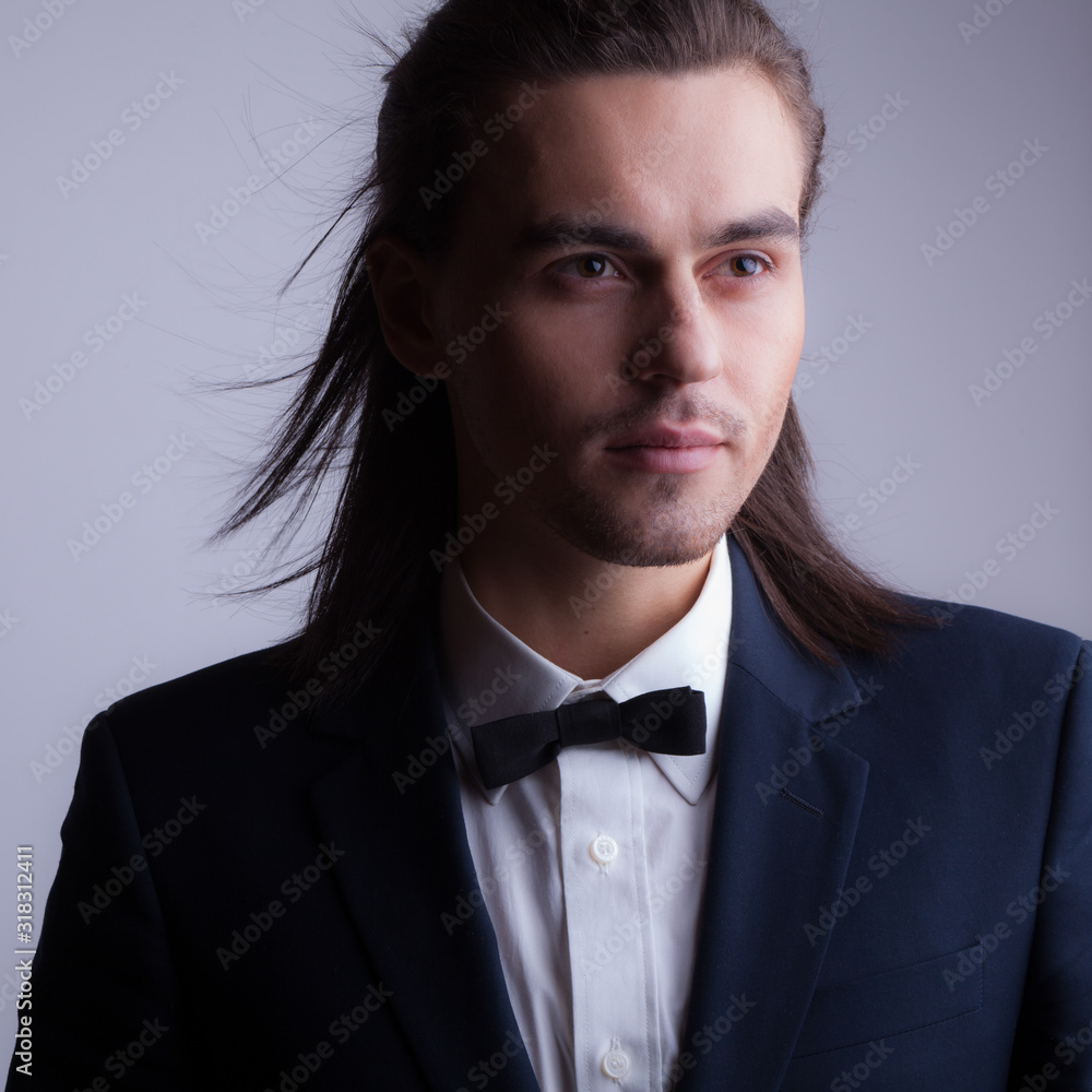 Handsome young elegant man studio portrait. Handsome young elegant man studio portrait.