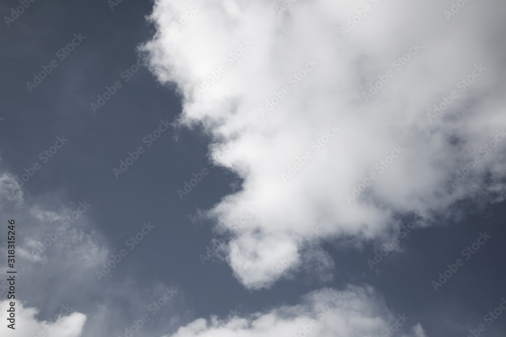 background of white fluffy cumulus clouds