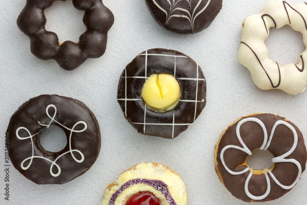 Set of various colorful donuts isolated on white background. Top view.