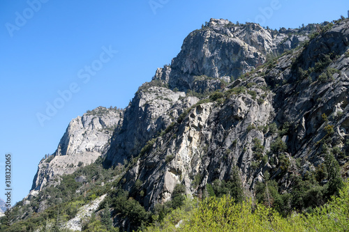 Landscape of grey granite mountain and forest at Kings Canyon National Park in California