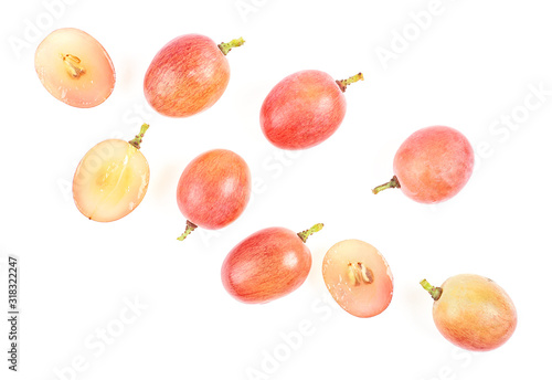 Fresh pink grapes on a white background, top view.
