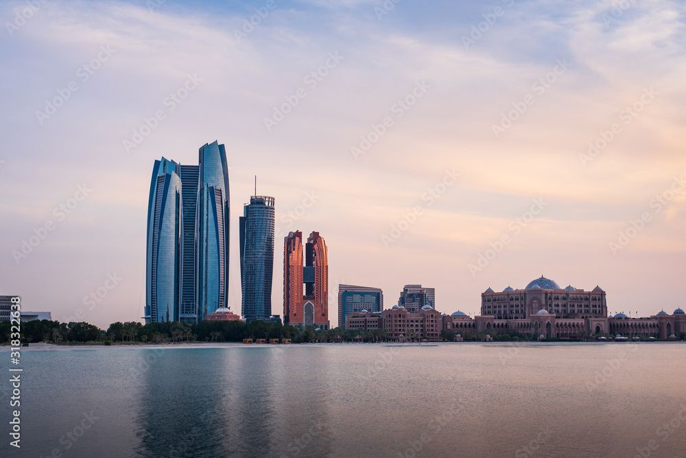 Sunset over Abu Dhabi skyline and Emirates palace