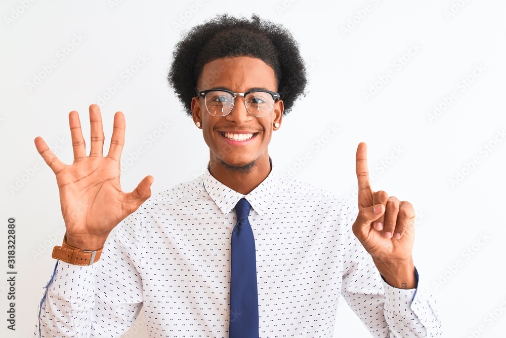 Young african american businessman wearing tie and glasses over isolated white background showing and pointing up with fingers number six while smiling confident and happy. Young african american businessman wearing tie and glasses over isolated white background showing and pointing up with fingers number six while smiling confident and happy.