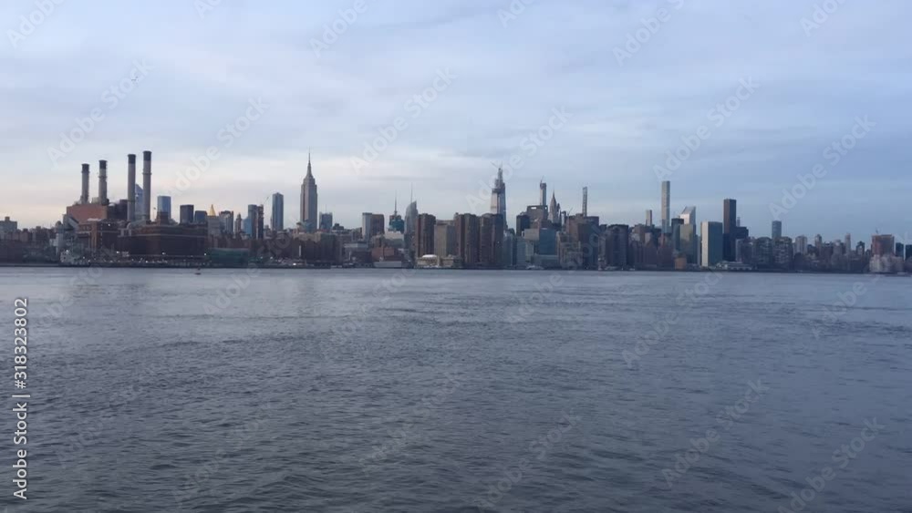 New York midtown Manhattan view across Hudson river showing skyline buildings Empire state building stock footage New York midtown Manhattan view across Hudson river showing skyline buildings Empire state building stock footage