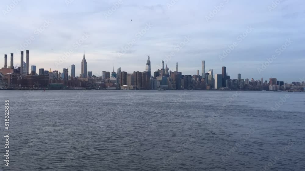 New York midtown Manhattan view across Hudson river showing skyline buildings Empire state building stock footage New York midtown Manhattan view across Hudson river showing skyline buildings Empire state building stock footage