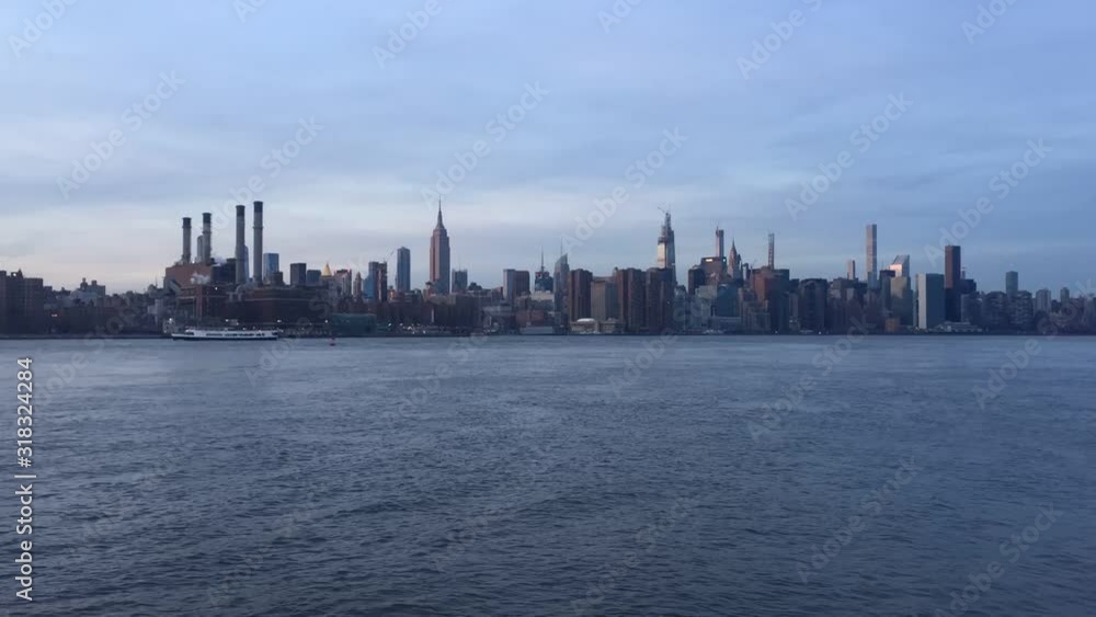 New York midtown Manhattan view across Hudson river showing skyline buildings Empire state building stock footage New York midtown Manhattan view across Hudson river showing skyline buildings Empire state building stock footage