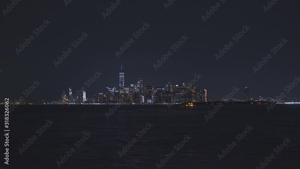 New York downtown at night with illuminated Brooklyn bridge. City lights New York downtown at night with illuminated Brooklyn bridge. City lights