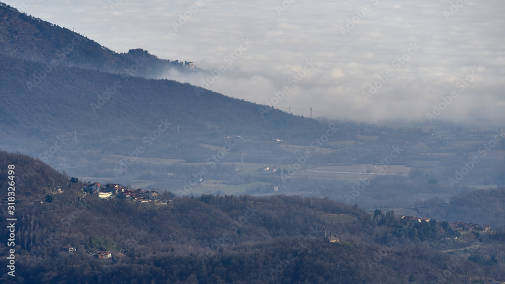 Panoramica su Cumiana con Castello di Piossasco e nebbia