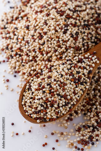 mix of quinoa grains on white acrylic background