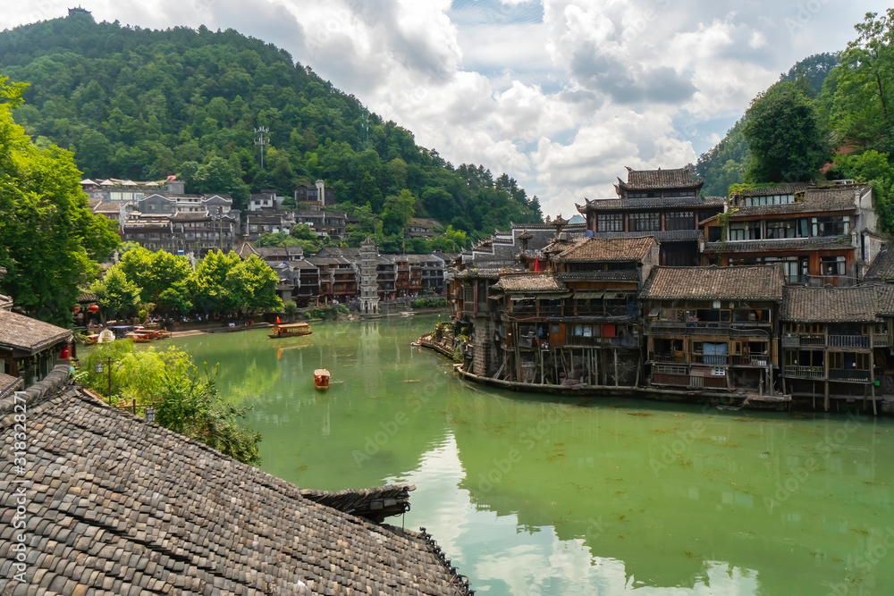 Traditional Chinese houses surround the Tuojiang river. Fenghuang Ancient Town, Hunan province, China