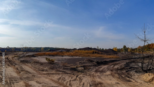 Abandoned and flooded quarry for coal mining. Horizontal photo
