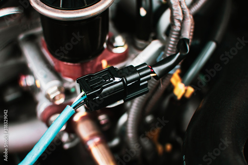 Quadro em tela Electric socket wire connector to car O2 oxygen sensor of engine system, automotive part concept
