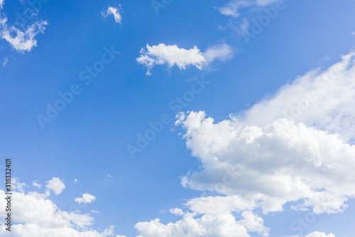 Blue sky on a sunny day with fluffy clouds
