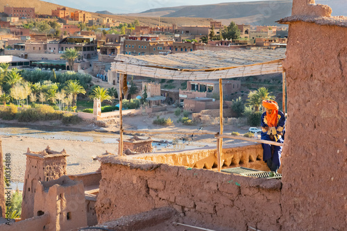 Nomad tuareg sitting on a terrace in Ait Ben Haddou photo