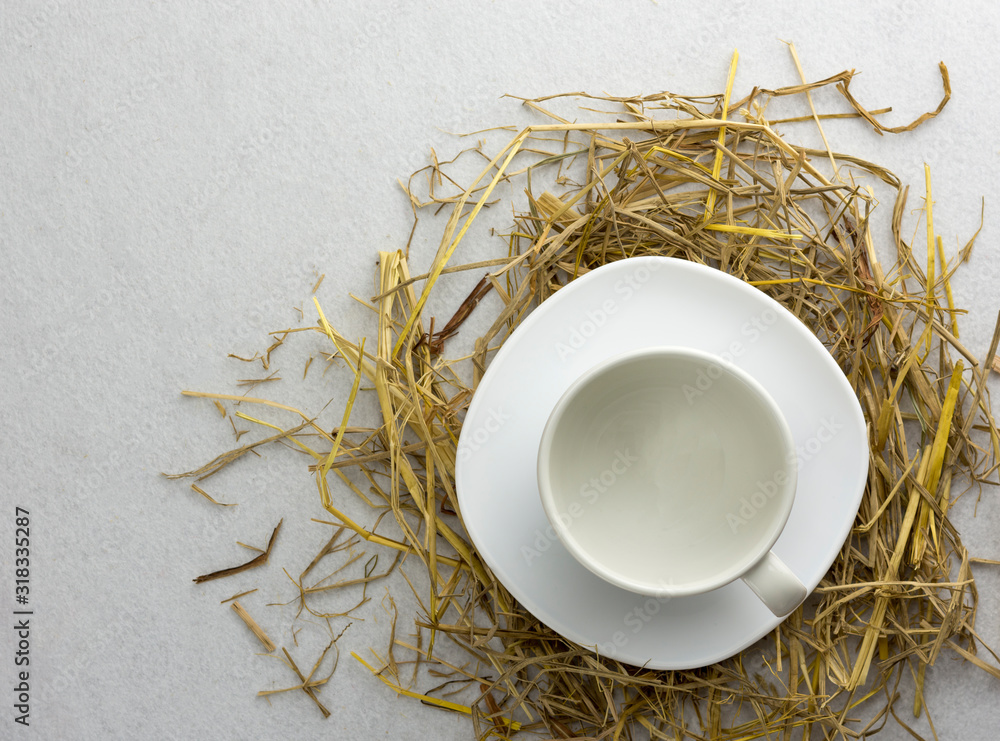 Coffee cup on a straw isolated on a white background.