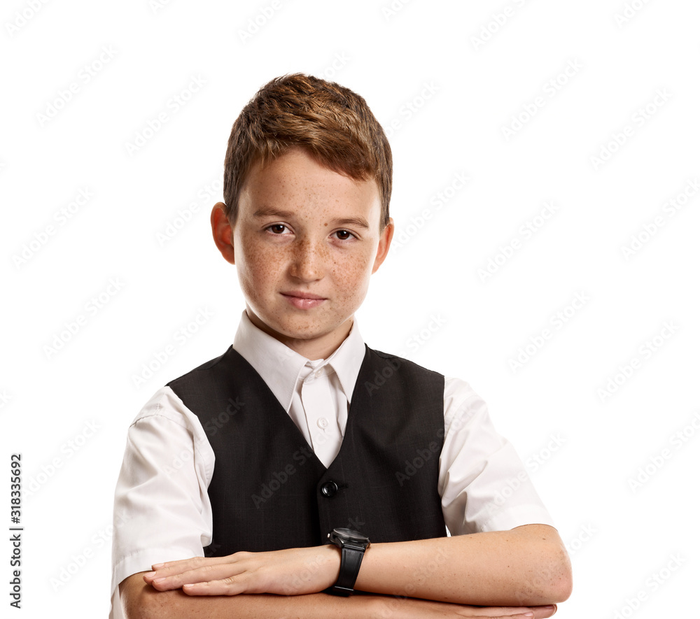 Portrait of young smiling intelligent schoolboy with folded hands on white background Portrait of young smiling intelligent schoolboy with folded hands on white background