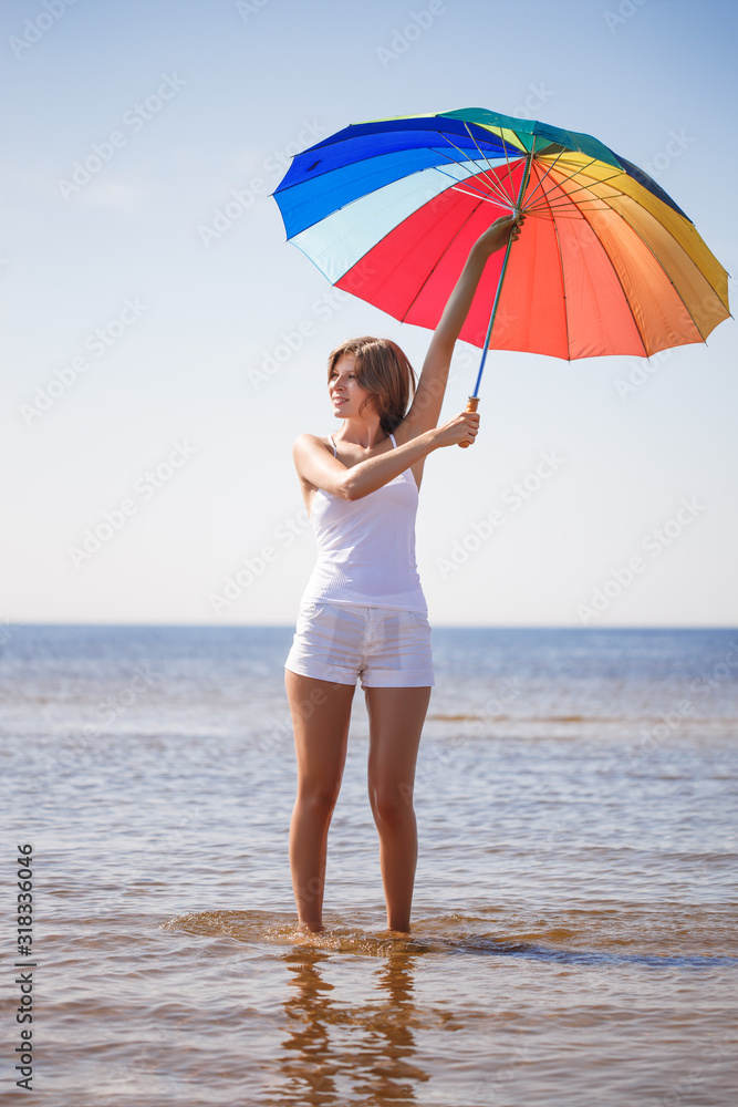 Woman enjoys on beach. Girl jumps on waves and laughs. Model in swimsuit on ocean vacation. Tourism and rest Woman enjoys on beach. Girl jumps on waves and laughs. Model in swimsuit on ocean vacation. Tourism and rest