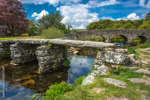 Medieval clapper bridge over the East Dart River at Postbridge on Dartmoor in Devon, West Country, England, UK