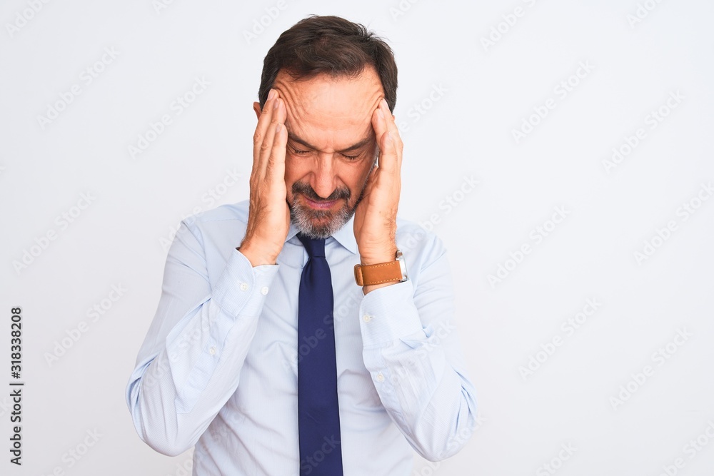 Middle age businessman wearing elegant tie standing over isolated white background with hand on head for pain in head because stress. Suffering migraine. Middle age businessman wearing elegant tie standing over isolated white background with hand on head for pain in head because stress. Suffering migraine.