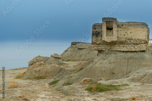Fortifications from Second World War, Feodosia, Crimea. View of ruins on the deserted coast. Historical landmark of Crimea